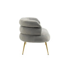 Poltrona di design in velluto con gambe in metallo